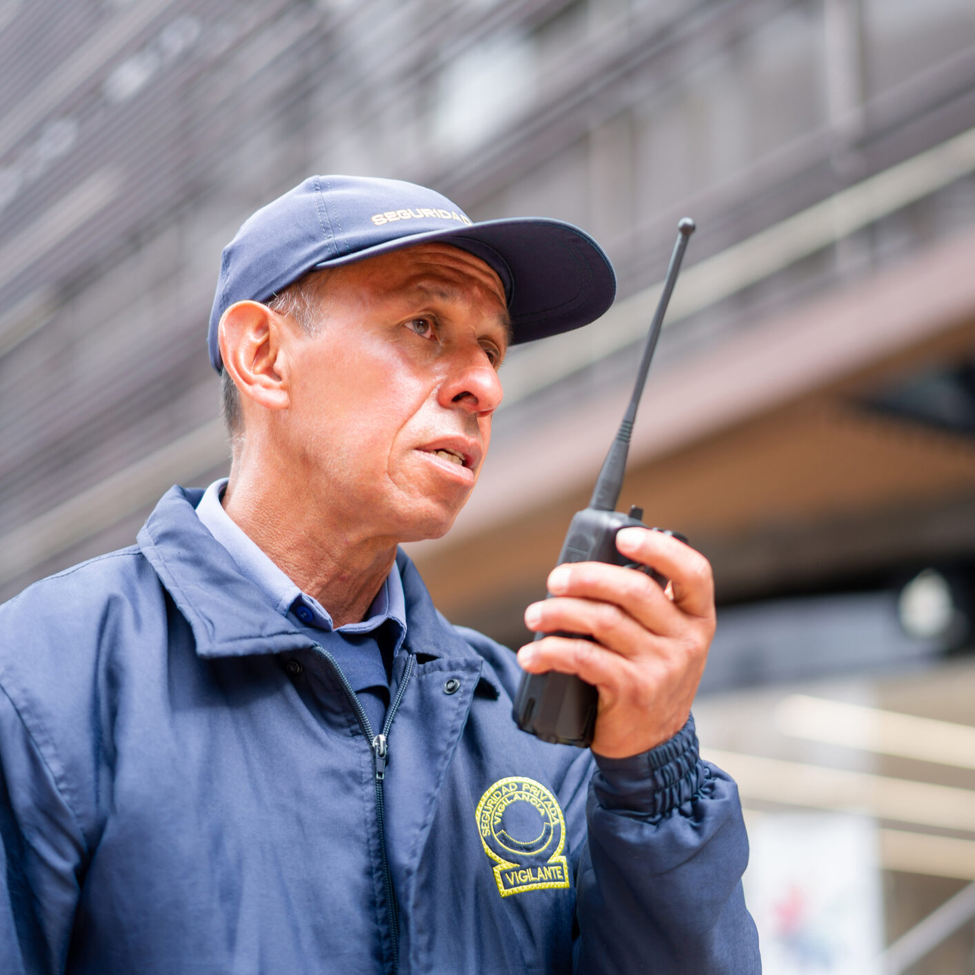 Security guard using a walkie-talkie