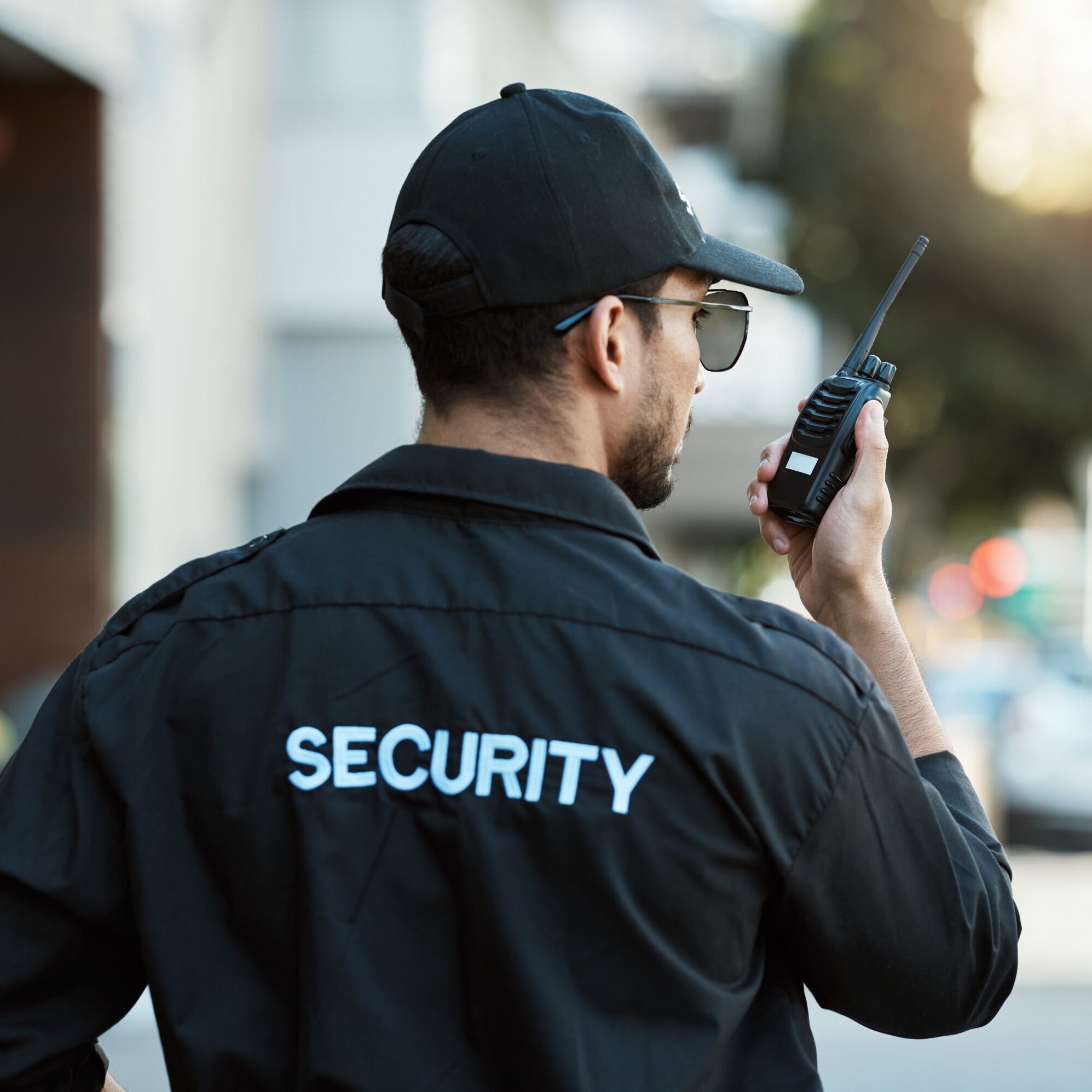 Security guard using a walkie-talkie