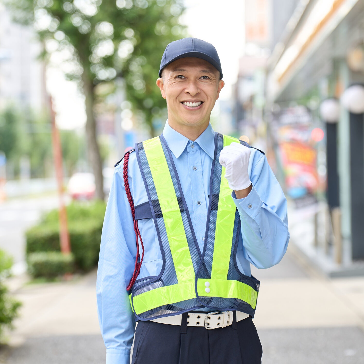 Happy worker outdoors on sidewalk