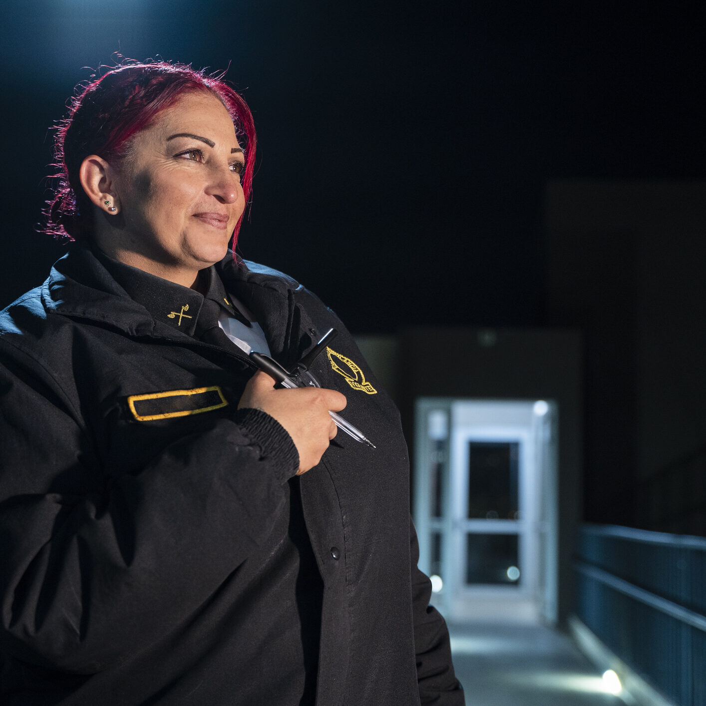 Woman in uniform at night