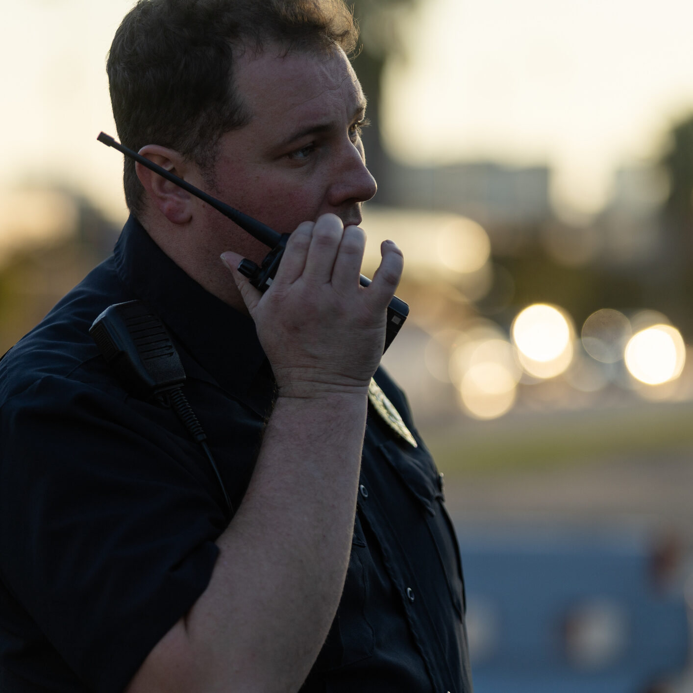 Policeman communicating via walkie-talkie