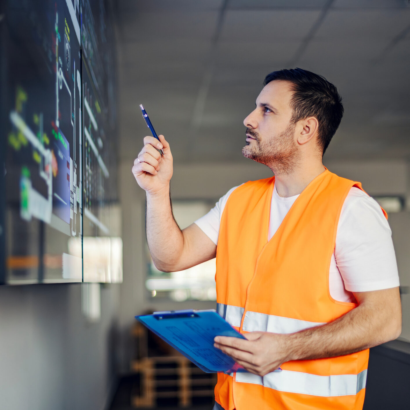 Engineer examining project plans on screen